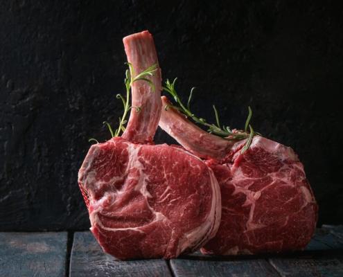 raw Black Angus tomahawk steaks