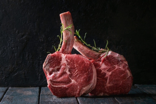 raw Black Angus tomahawk steaks