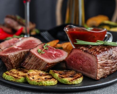 sliced beef tenderloin on a plate