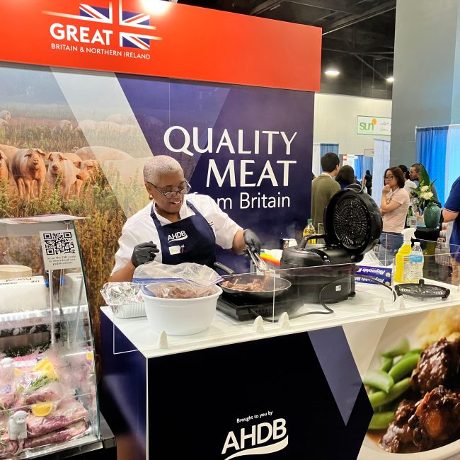 A chef demonstrates how to cook a pork dish at the AHDB stand in Miami, September 2024