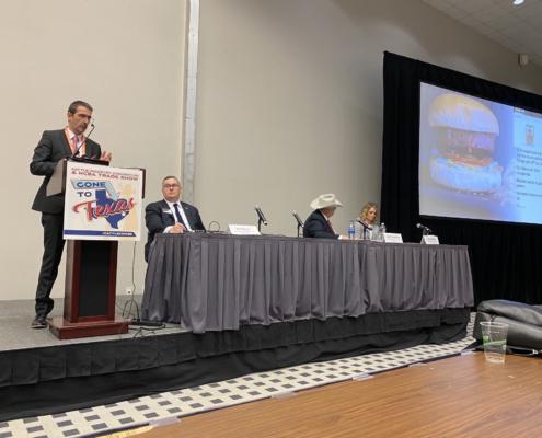 speaker panel at a cattle industry convention in Texas