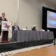 speaker panel at a cattle industry convention in Texas
